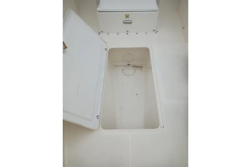 Slide: The Image of Open storage compartment in 2002 Paramount Supper Fish boat interior. - 8