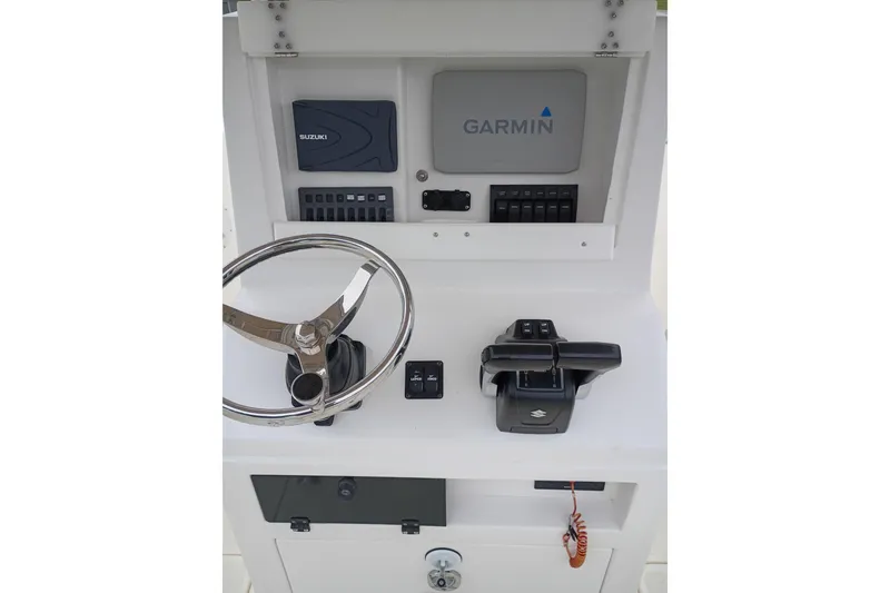 Slide: The Image of Boat console with Garmin and Suzuki controls, Paramount Supper Fish 2002 model. - 3