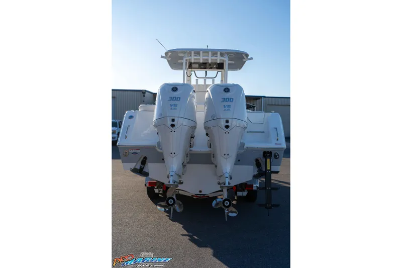 Slide: The Image of 2026 Sea Hunt Ultra 285 SE boat with dual 300 V6 engines, rear view. - 17