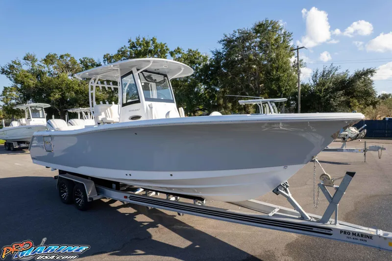 The Image of 2026 Sea Hunt Ultra 285 SE boat on trailer, displayed outdoors. - 0