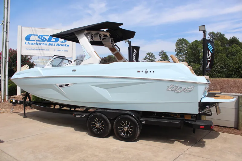 Slide: The Image of 2026 Tigé 24RZX boat on trailer at Charlotte Ski Boats dealership. - 3