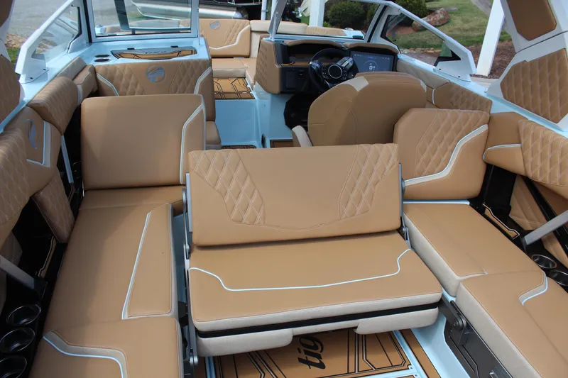 Slide: The Image of Luxurious interior of 2026 Tigé 24RZX boat with tan leather seating. - 16