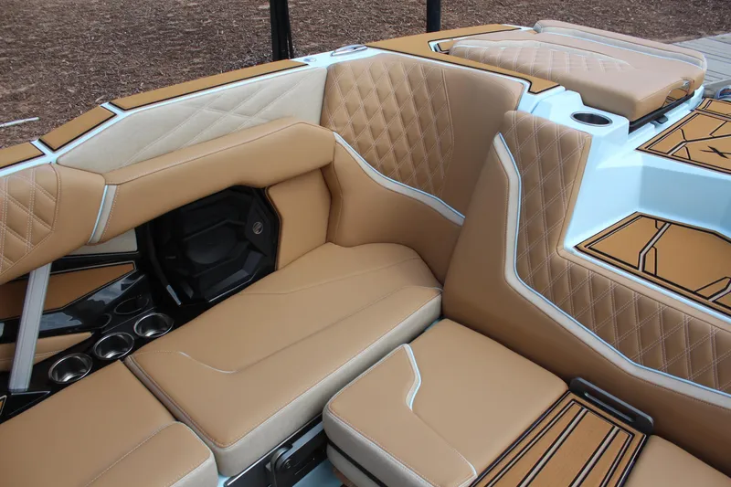 Slide: The Image of Luxurious interior of 2026 Tigé 24RZX boat with tan leather seating. - 15
