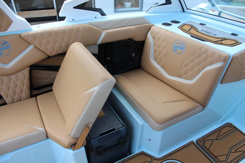 Slide: The Image of 2026 Tigé 24RZX boat interior with tan leather seats and modern design. - 12