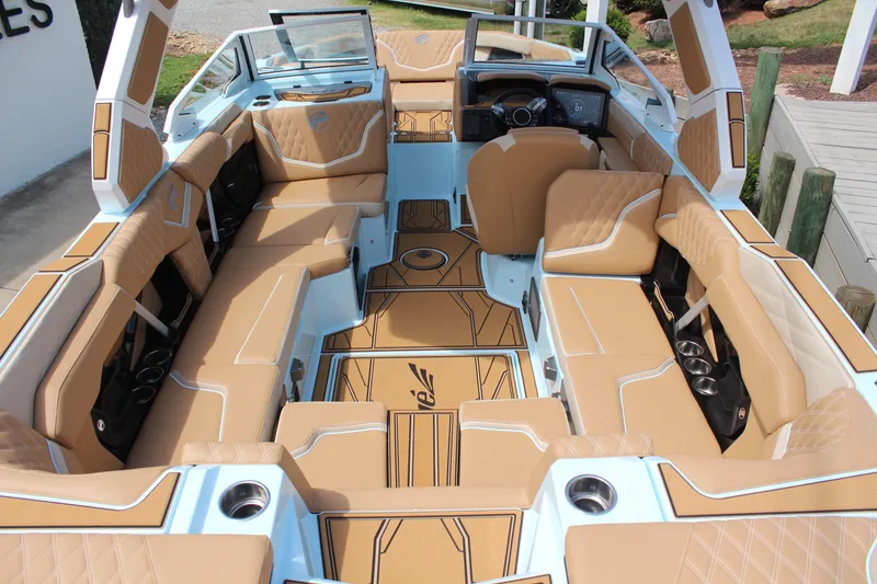 Slide: The Image of Luxurious interior of 2026 Tigé 24RZX boat with tan upholstery and modern design. - 7