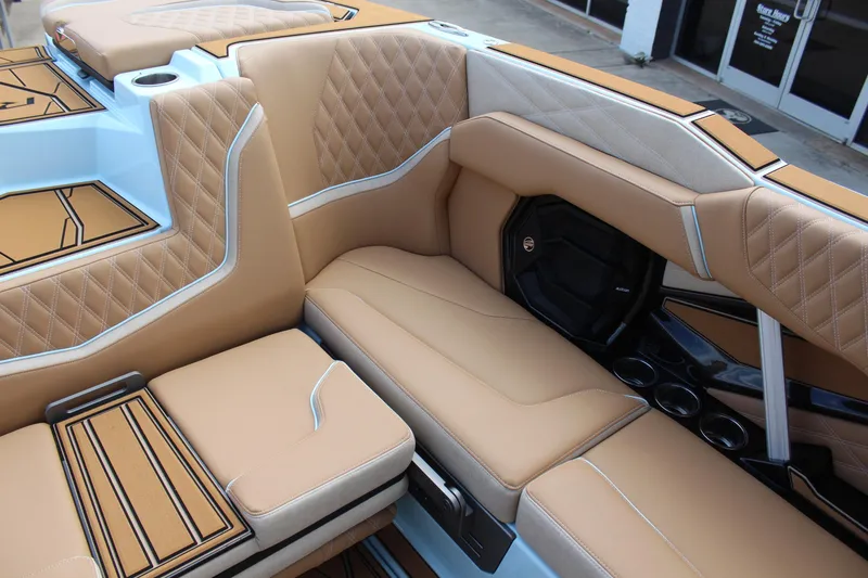 Slide: The Image of Luxurious interior of 2026 Tigé 24RZX boat with tan leather seating. - 14