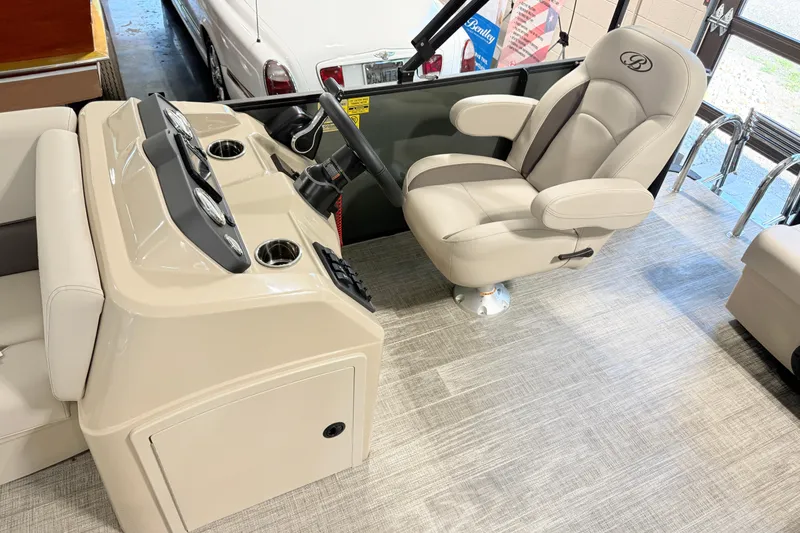 Slide: The Image of 2026 Bentley Pontoons LE 160 CR interior with steering console and captain's chair. - 4