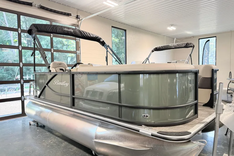 The Image of 2026 Bentley Pontoons LE 160 CR in showroom, featuring sleek design and modern amenities. - 0