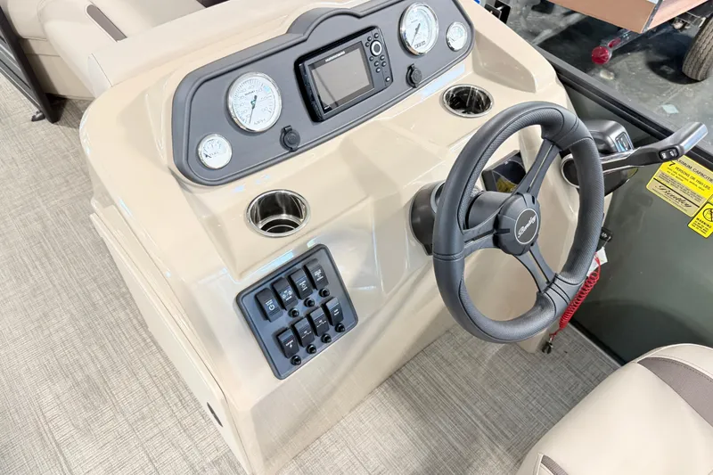 Slide: The Image of 2026 Bentley Pontoons LE 160 CR dashboard with steering wheel and control panel. - 5