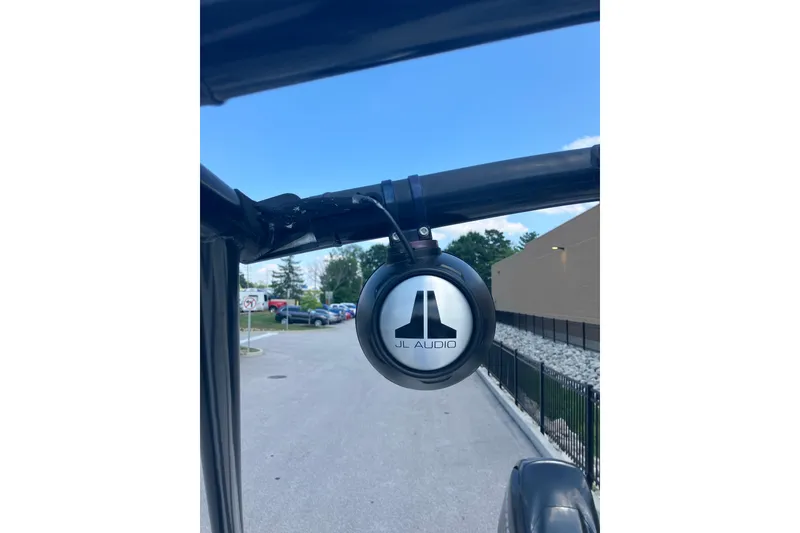Slide: The Image of JL Audio speaker on a 2018 Bayliner Element E16 boat, outdoor setting. - 10
