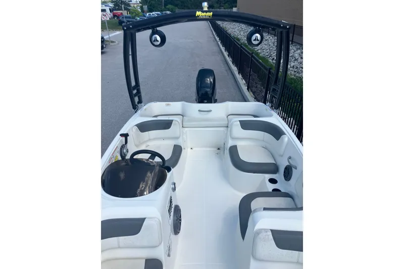 Slide: The Image of 2018 Bayliner Element E16 boat interior with seating and steering wheel. - 5