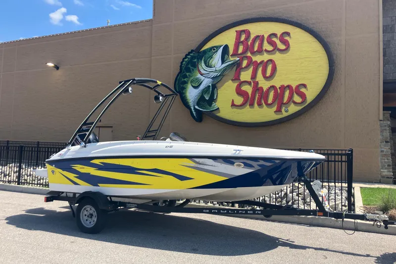 The Image of 2018 Bayliner Element E16 boat on trailer outside Bass Pro Shops. - 0