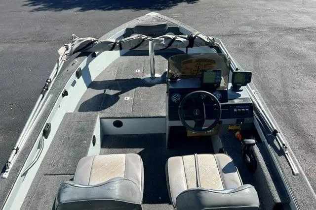 Slide: The Image of 1995 Bass Tracker Pro 17 boat interior with dual seats and navigation equipment. - 6