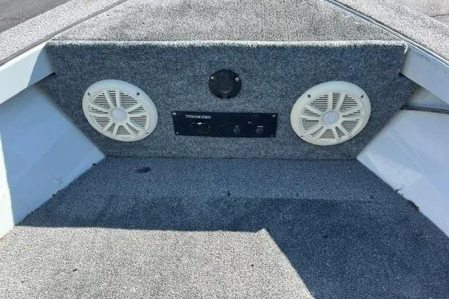 Slide: The Image of 1995 Bass Tracker Pro 17 boat interior with speakers and stereo system. - 7