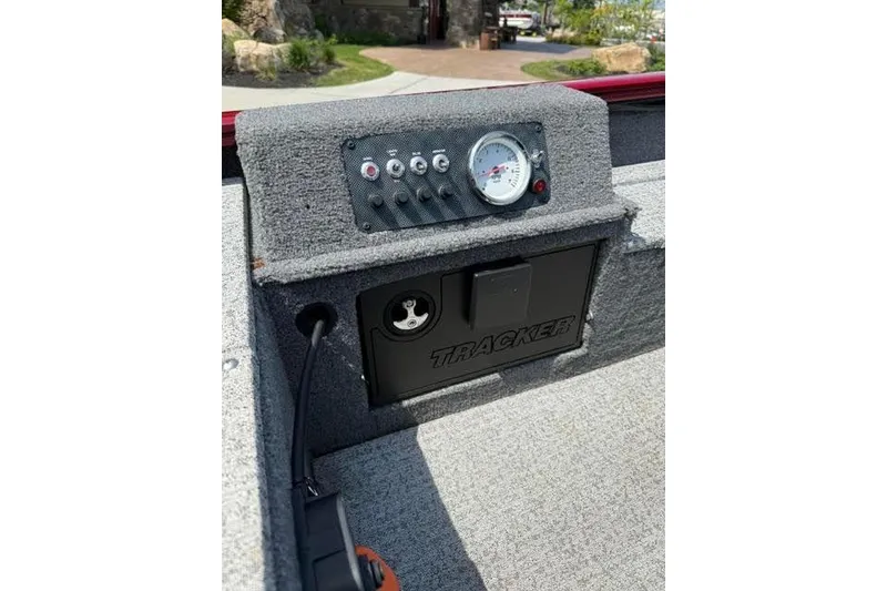 Slide: The Image of 2021 Tracker Super Guide V-16 T boat dashboard with controls and gauge. - 9