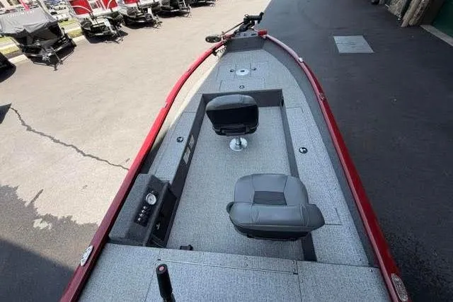 Slide: The Image of 2021 Tracker Super Guide V-16 T boat with dual seats and red trim. - 5