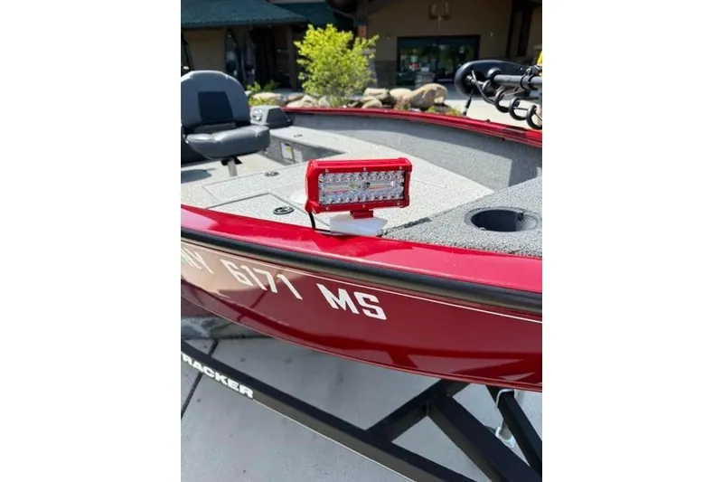 Slide: The Image of Red 2021 Tracker Super Guide V-16 T boat with mounted LED light on deck. - 8