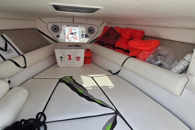 Slide: The Image of Interior of 2019 Glasstream 328 SCX boat with seating, life jackets, and storage. - 14