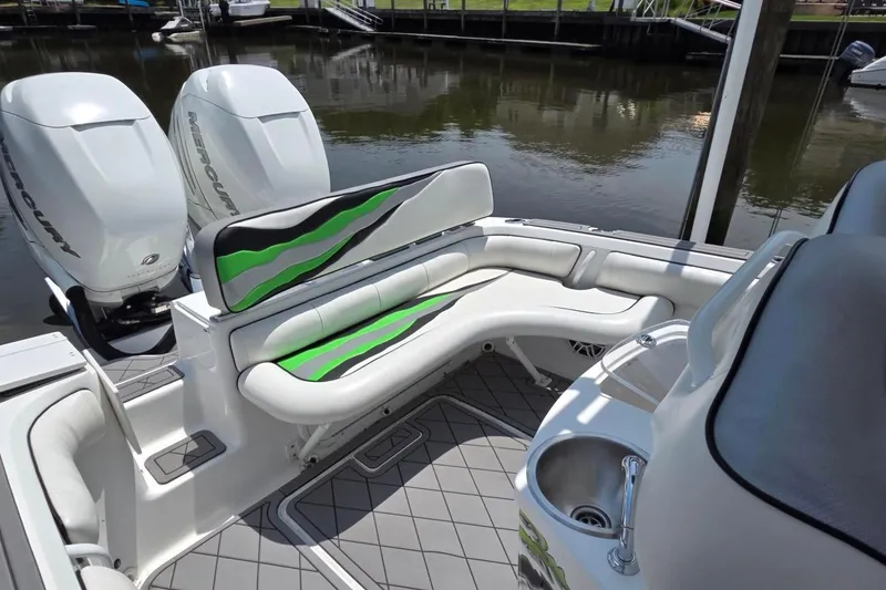 Slide: The Image of 2019 Glasstream 328 SCX boat interior with seating and twin Mercury engines. - 3