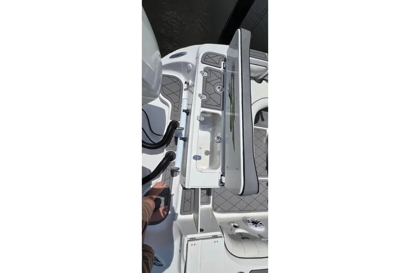 Slide: The Image of 2019 Glasstream 328 SCX boat interior with open storage compartment and sleek design. - 4