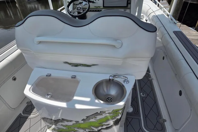 Slide: The Image of 2019 Glasstream 328 SCX boat interior with sink and seating area. - 6