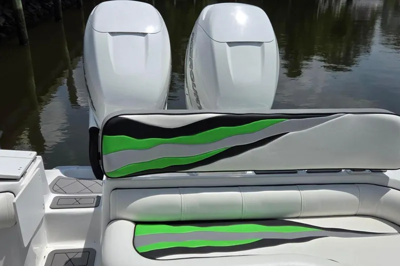 Slide: The Image of 2019 Glasstream 328 SCX boat with stylish green and black seating, dual engines. - 5