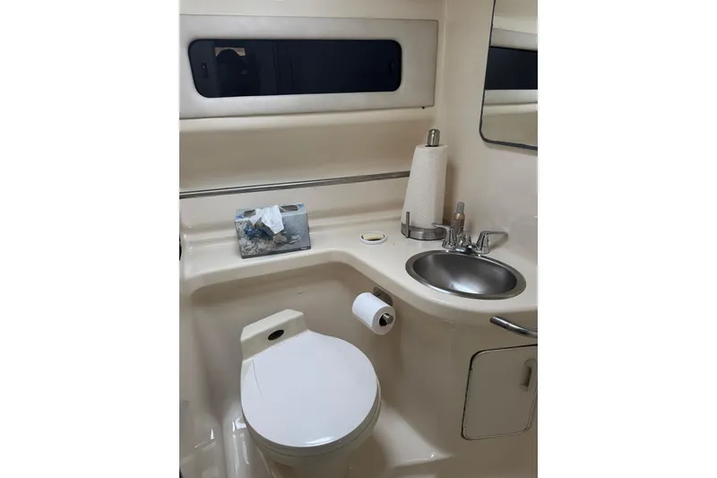 Slide: The Image of Bathroom interior of 1993 Sea Ray Sundancer 330 yacht, featuring toilet and sink. - 17