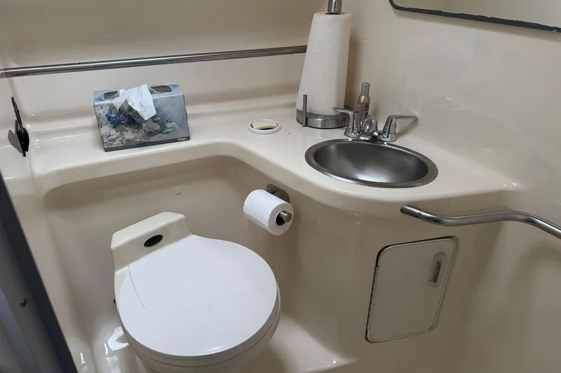 Slide: The Image of Bathroom interior of 1993 Sea Ray Sundancer 330 yacht, featuring toilet and sink. - 18
