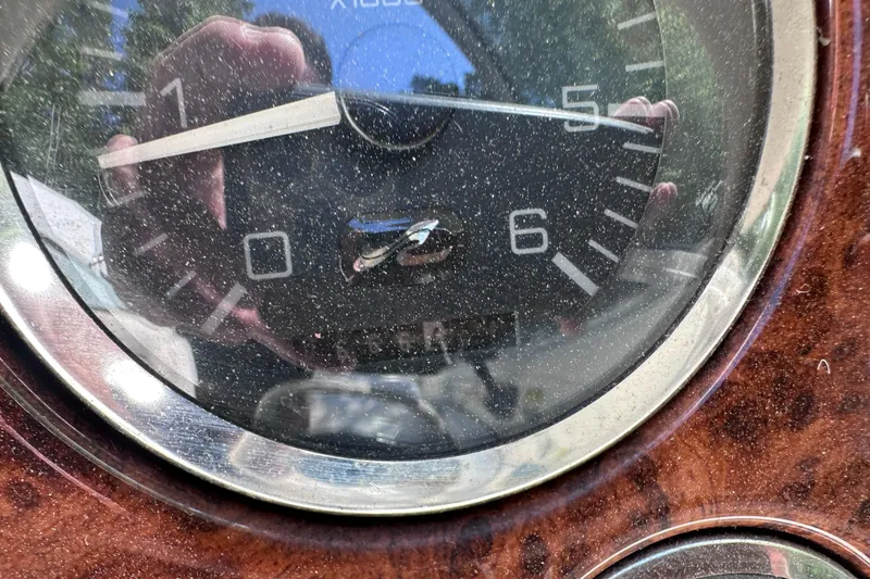 Slide: The Image of Close-up of a dusty tachometer on a 1998 Sea Ray 260 Signature boat. - 23
