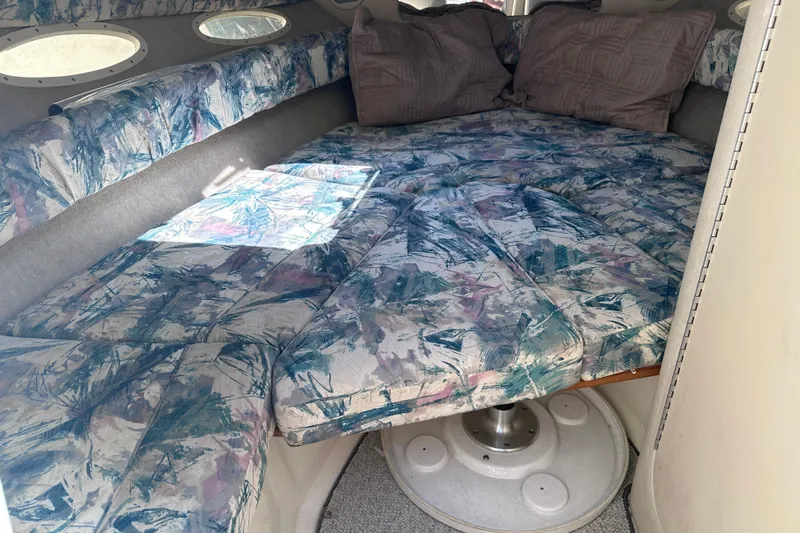 Slide: The Image of Interior cabin of a 1998 Sea Ray 260 Signature boat with patterned cushions. - 18