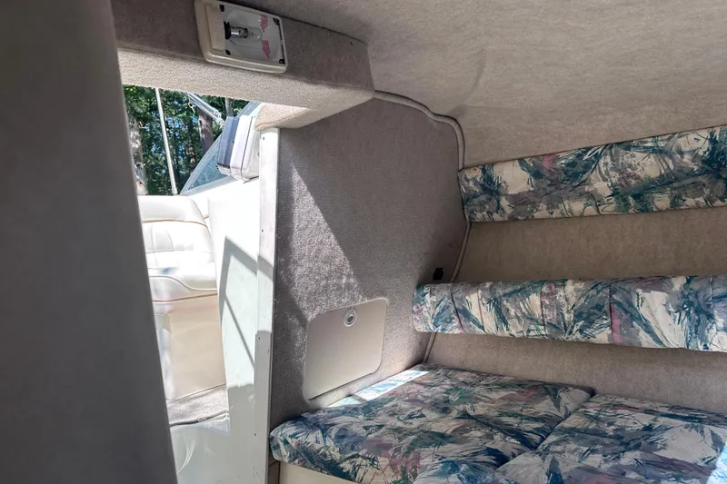 Slide: The Image of Interior cabin of 1998 Sea Ray 260 Signature boat with patterned seating. - 20