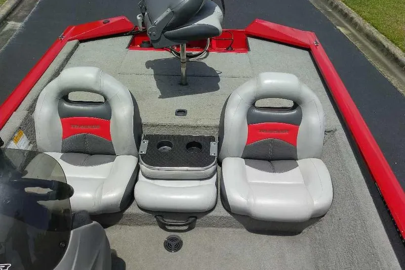 Slide: The Image of 2009 Tracker Pro Team 175 TXW boat interior with gray and red seating. - 4