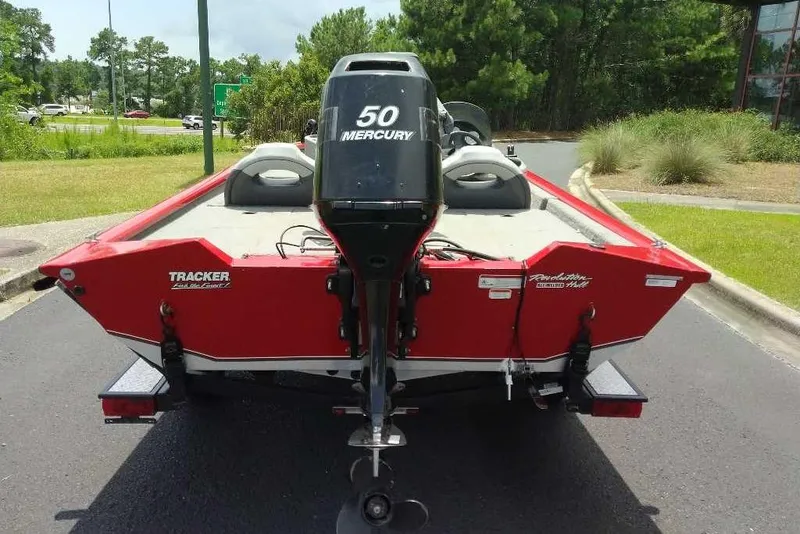 Slide: The Image of 2009 Tracker Pro Team 175 TXW boat with Mercury 50 engine, parked outdoors. - 5