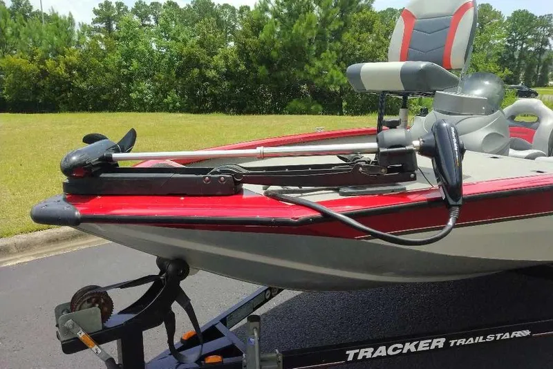 Slide: The Image of 2009 Tracker Pro Team 175 TXW boat on trailer, featuring trolling motor and seating. - 10