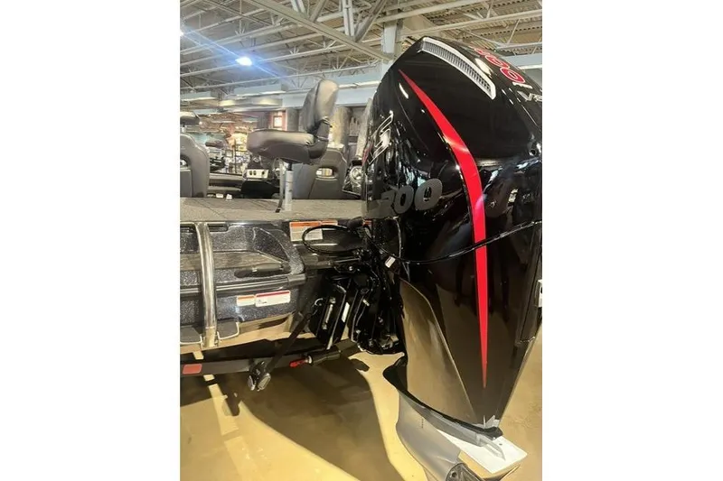 Slide: The Image of 2026 Nitro Z19 XL boat with powerful black and red outboard motor in showroom. - 2