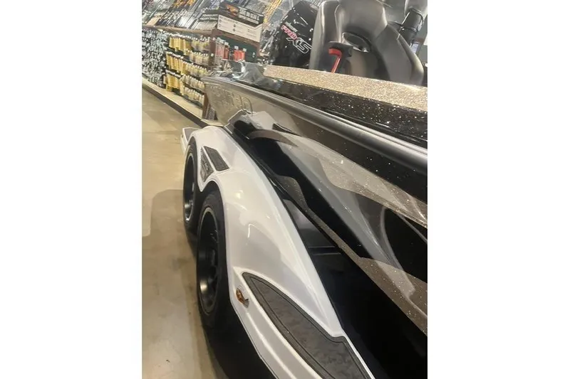 Slide: The Image of 2026 Nitro Z19 XL boat in showroom, showcasing sleek design and glossy finish. - 10