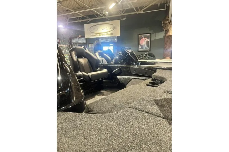 Slide: The Image of 2026 Nitro Z19 XL boat interior with seating, displayed in a showroom. - 9