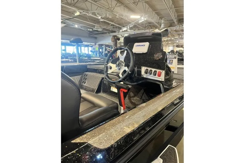 Slide: The Image of 2026 Nitro Z19 XL boat interior with steering wheel and control panel. - 4