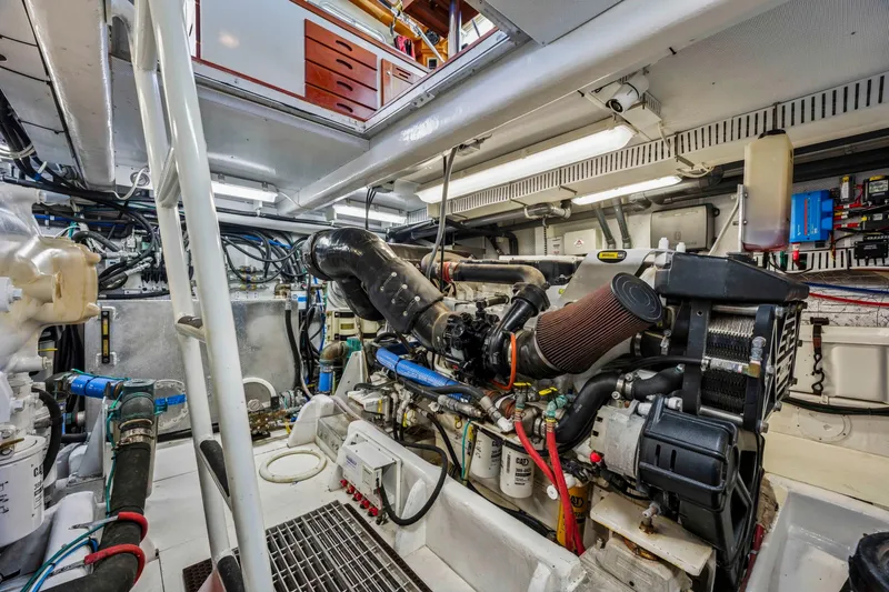 Slide: The Image of Engine room of 2018 Dixon 55 yacht, showcasing complex machinery and equipment. - 49