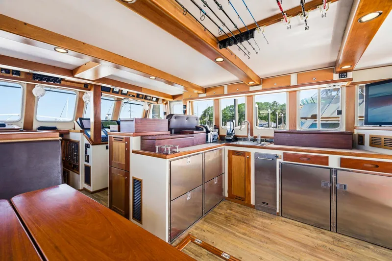 Slide: The Image of Luxurious 2018 Dixon 55 yacht interior with modern kitchen and wooden accents. - 37