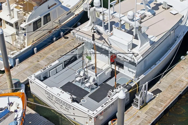 Slide: The Image of Aerial view of a 2018 Dixon 55 boat docked at a marina. - 5