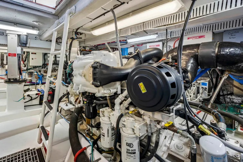 Slide: The Image of Engine room of a 2018 Dixon 55 yacht, showcasing complex machinery and equipment. - 48