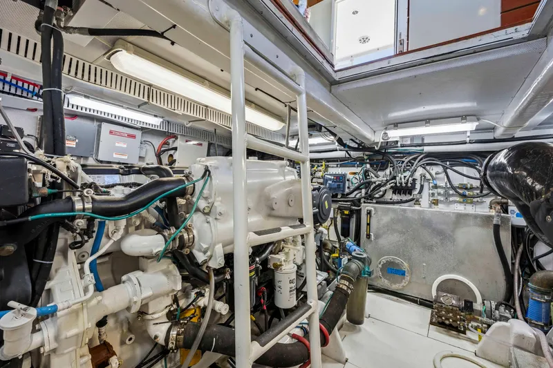 Slide: The Image of Engine room of a 2018 Dixon 55 yacht, showcasing complex machinery and wiring. - 47