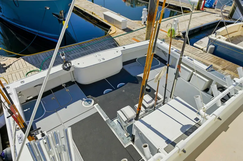 Slide: The Image of Fishing boat deck with rods, docked at marina; Dixon 55, 2018 model. - 22