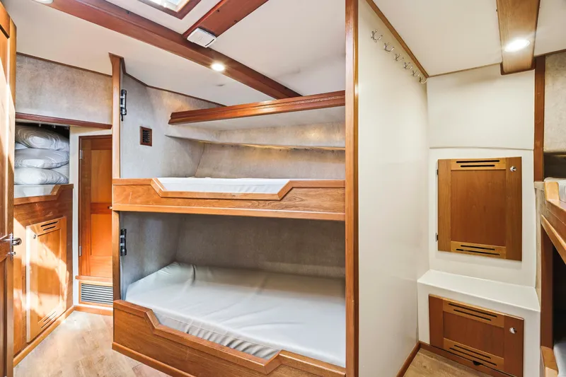 Slide: The Image of Cozy Dixon 55 yacht cabin with wooden bunk beds and storage, 2018 model. - 42