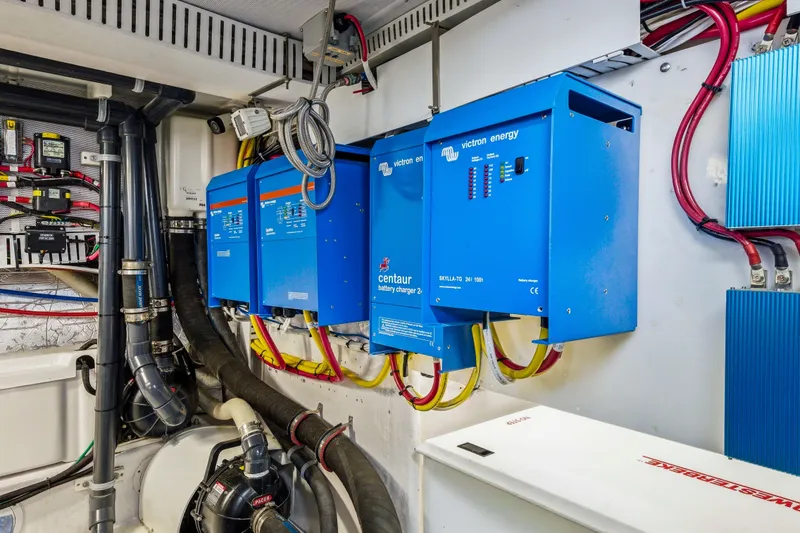 Slide: The Image of Electrical system setup with Victron Energy chargers in a Dixon 55, 2018 model. - 50