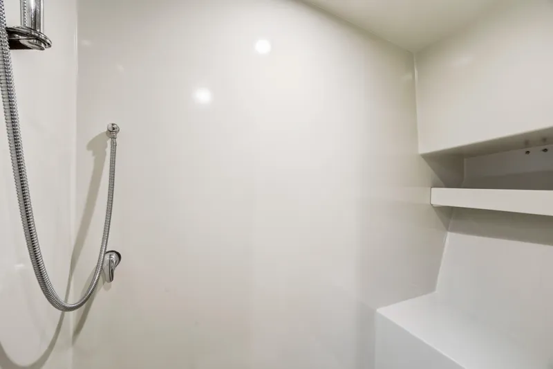 Slide: The Image of Modern shower interior with chrome fixtures and built-in shelving, Dixon model 55, 2018. - 45