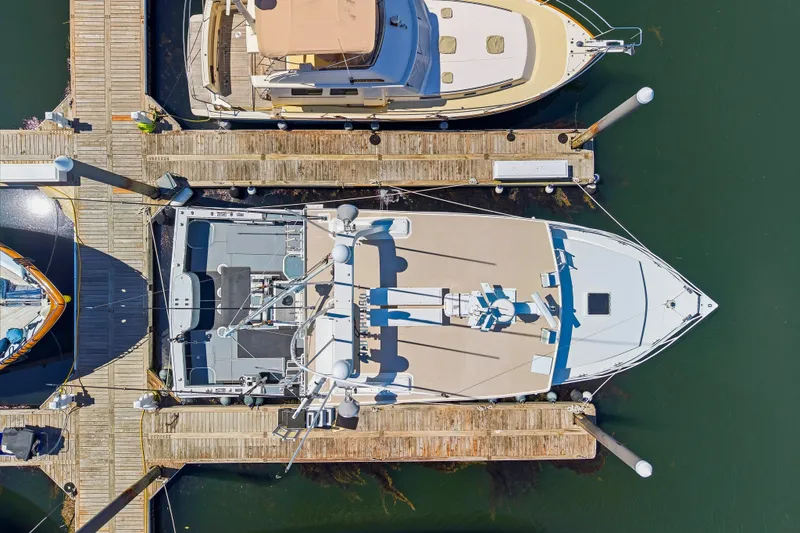 Slide: The Image of Aerial view of a 2018 Dixon 55 yacht docked at a marina. - 26