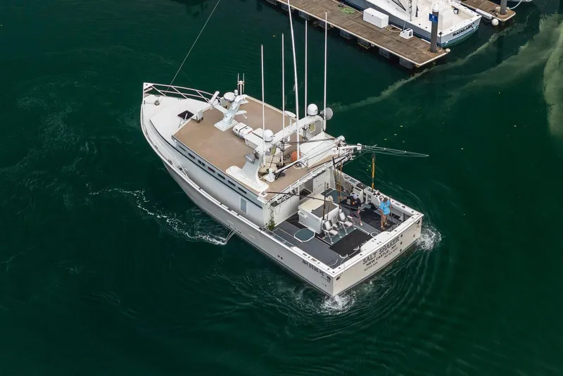 Slide: The Image of Aerial view of 2018 Dixon 55 boat navigating near a dock. - 11
