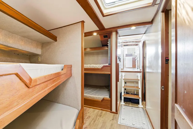 Slide: The Image of Interior of 2018 Dixon 55 yacht featuring cozy wooden bunk beds and modern design. - 41